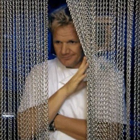 Gordon Ramsay coming from some metal curtains